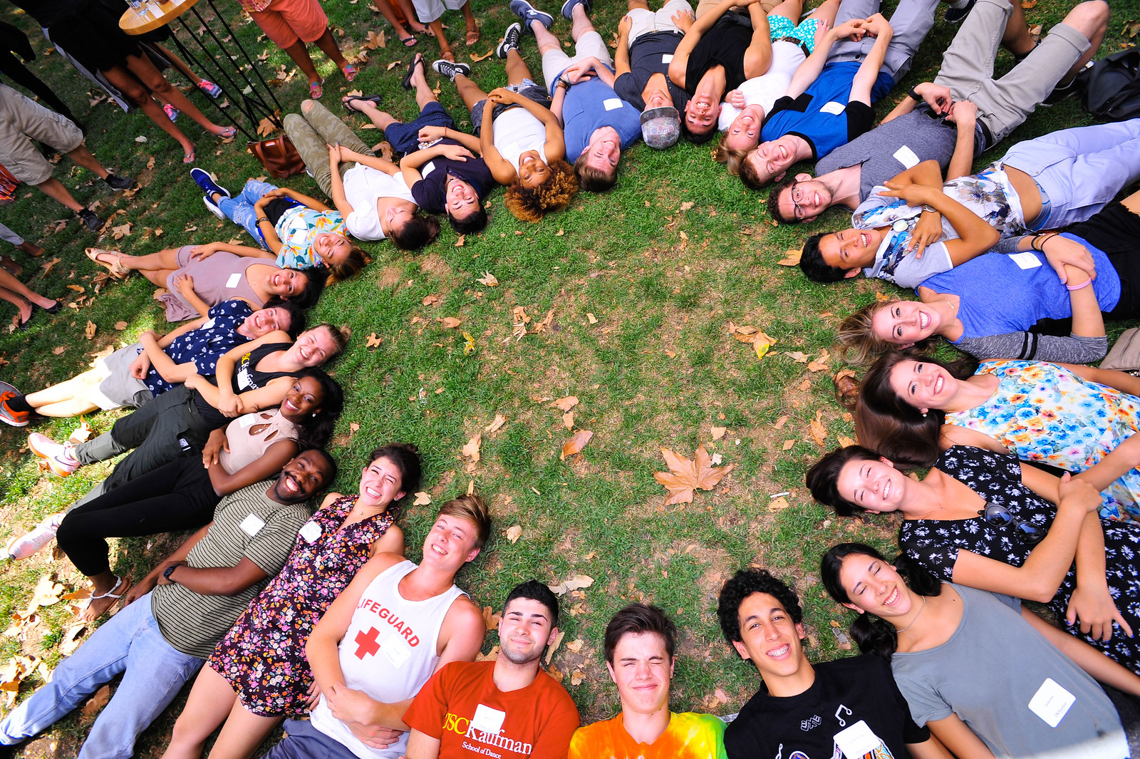 Students laying in a circle