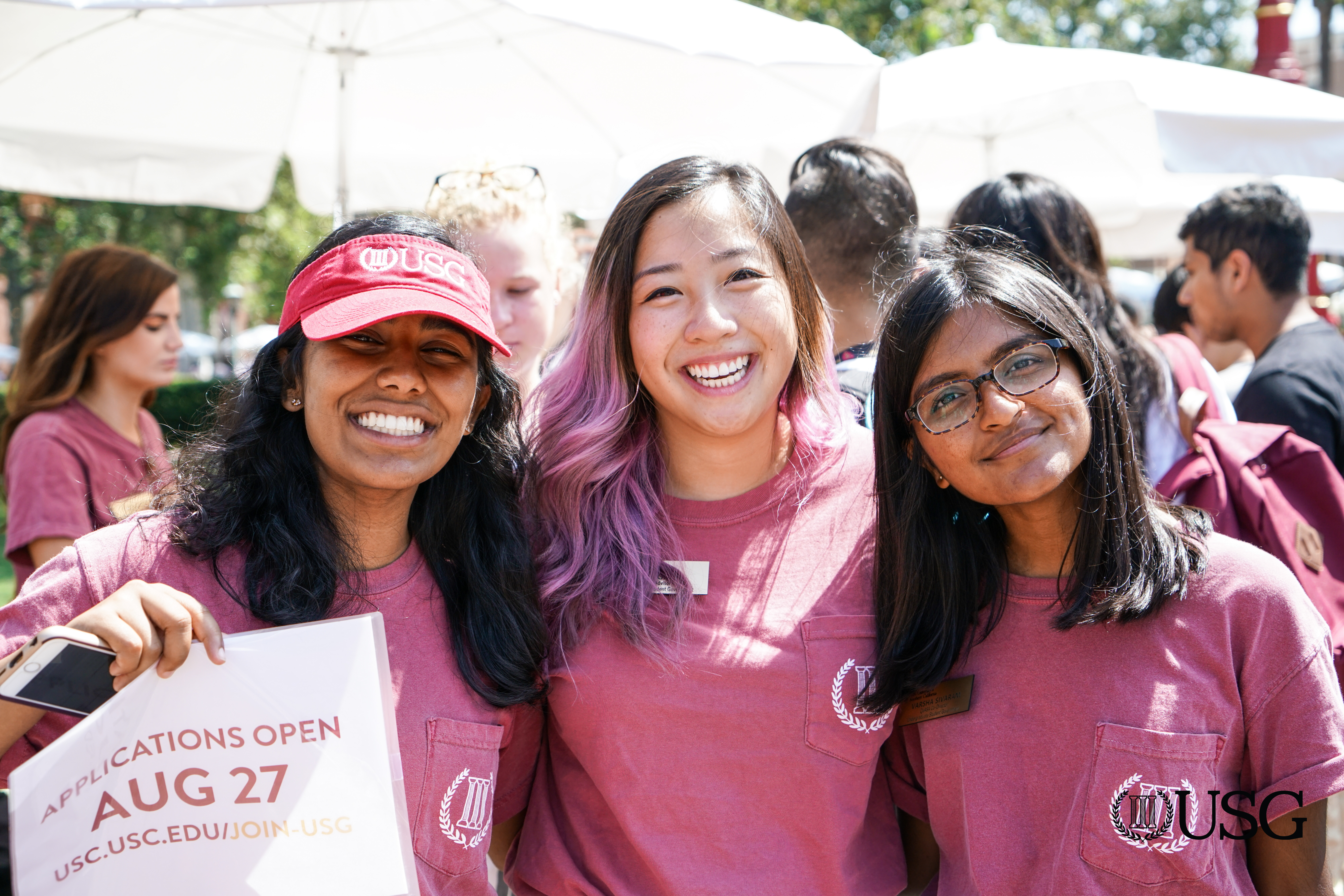 three students posing at involvement fair