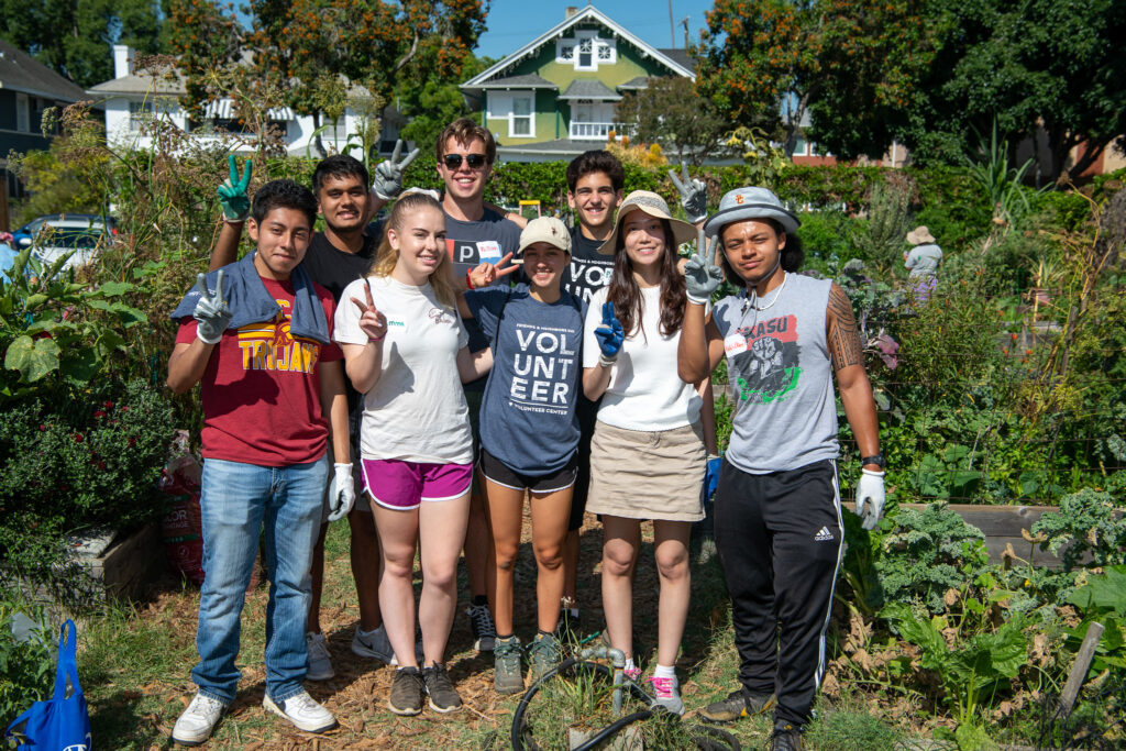 group of students volunteering in garden