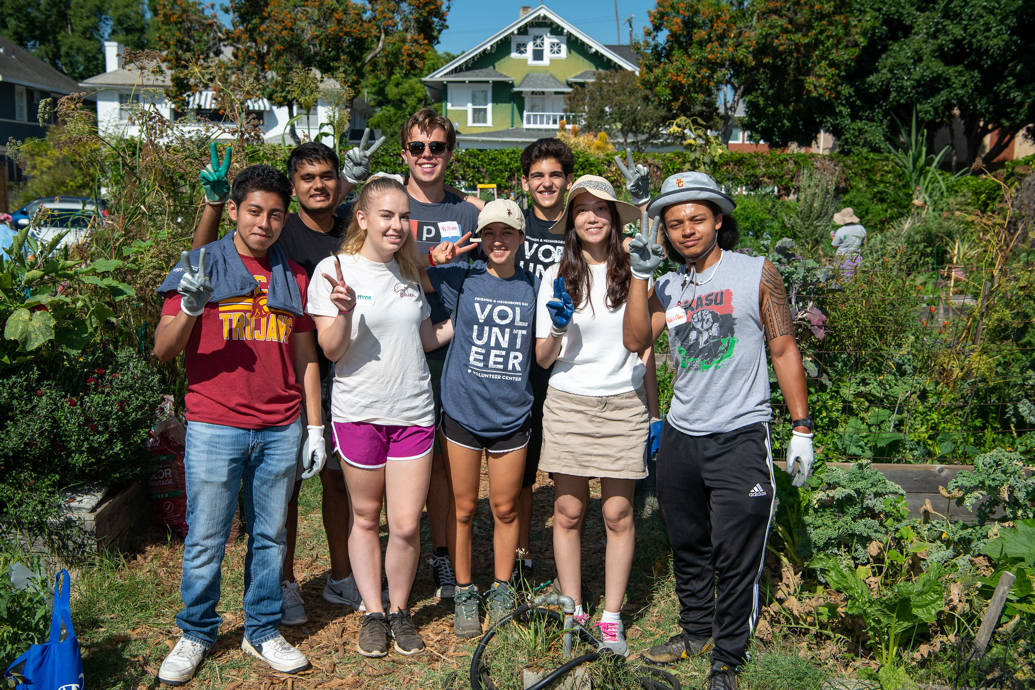 group of students volunteering in garden