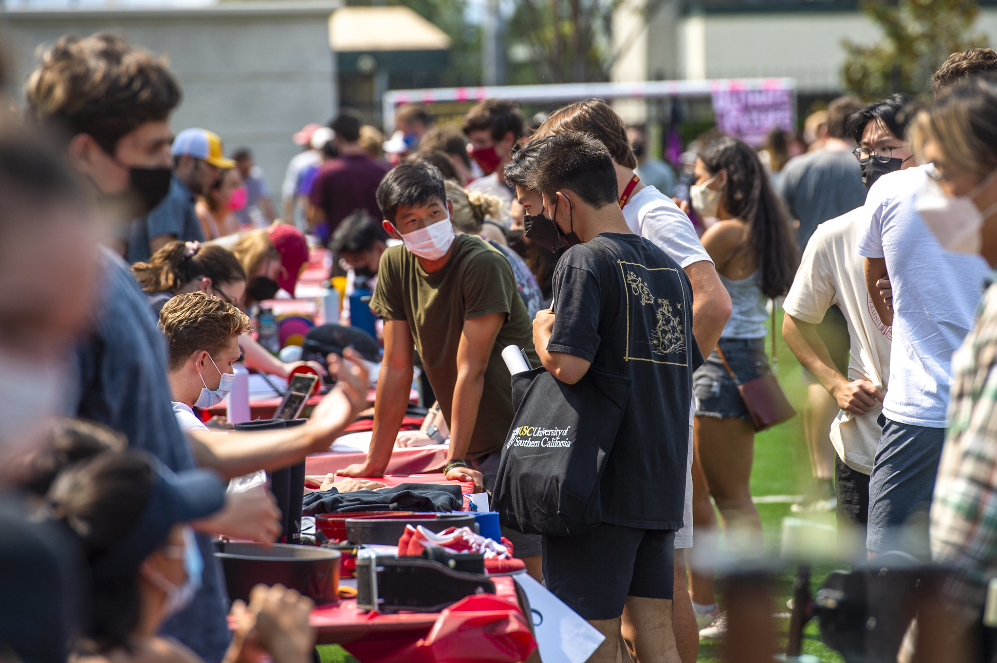 students checking out a table at involvement fair