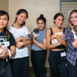 5 students volunteering at animal shelter