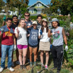group of students volunteering in garden